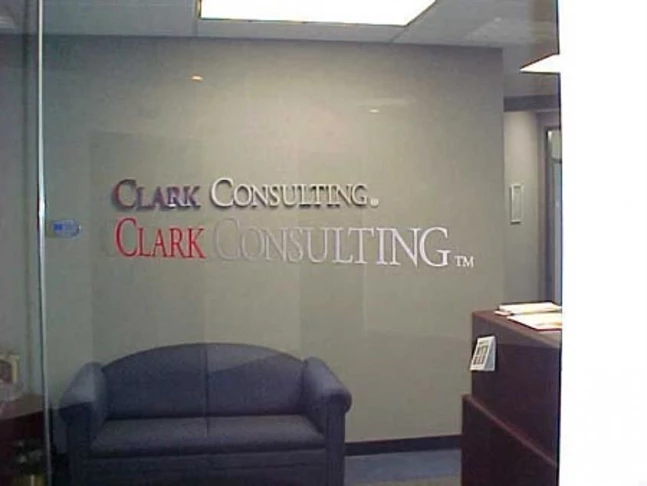 Custom Logo in dimensional carved letters for interior wall and window graphics