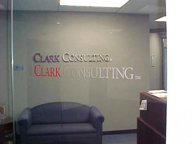 Custom Logo in dimensional carved letters for interior wall and window graphics